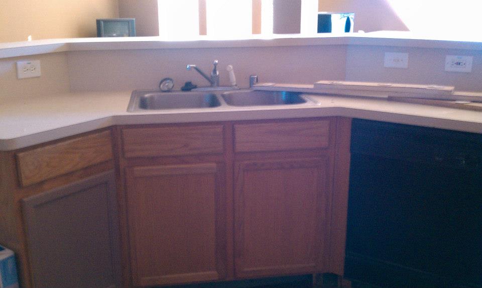 Before picture of raised bar to flat island,Formica countertops to granite countertop installation, kitchen island expansion, and open-concept kitchen conversion