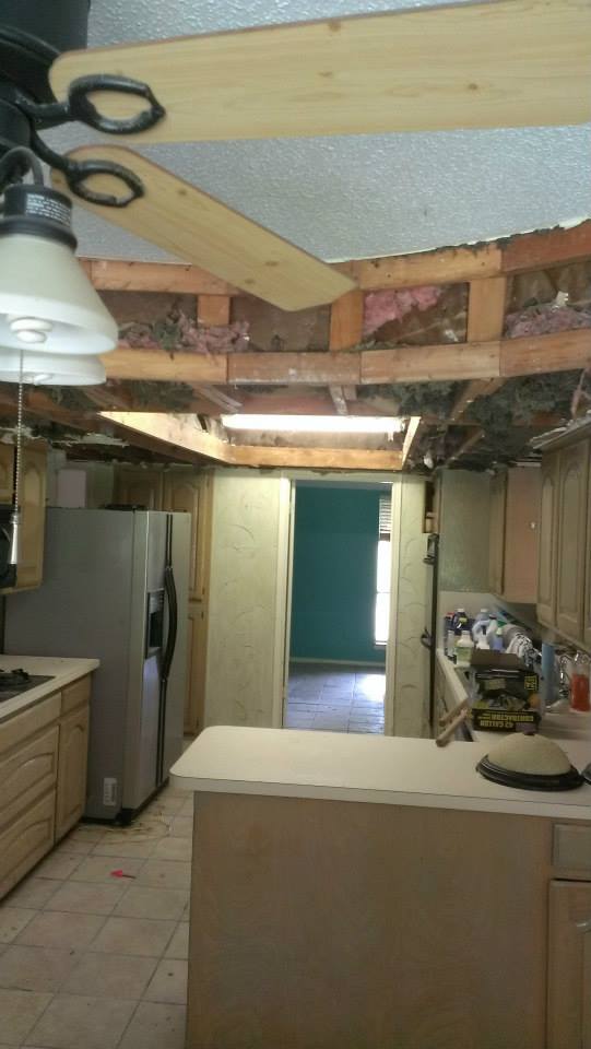 Out dated kitchen featuring low fur downs before ceiling height modernization